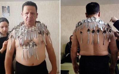 Iranian man breaks his own Guinness Record by balancing 96 spoons on body