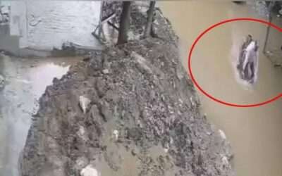 WATCH: Motorcyclist falls into pit filled with rainwater in Lahore