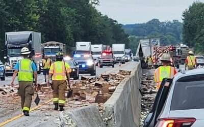 Thousands of hot dogs spill across busy highway